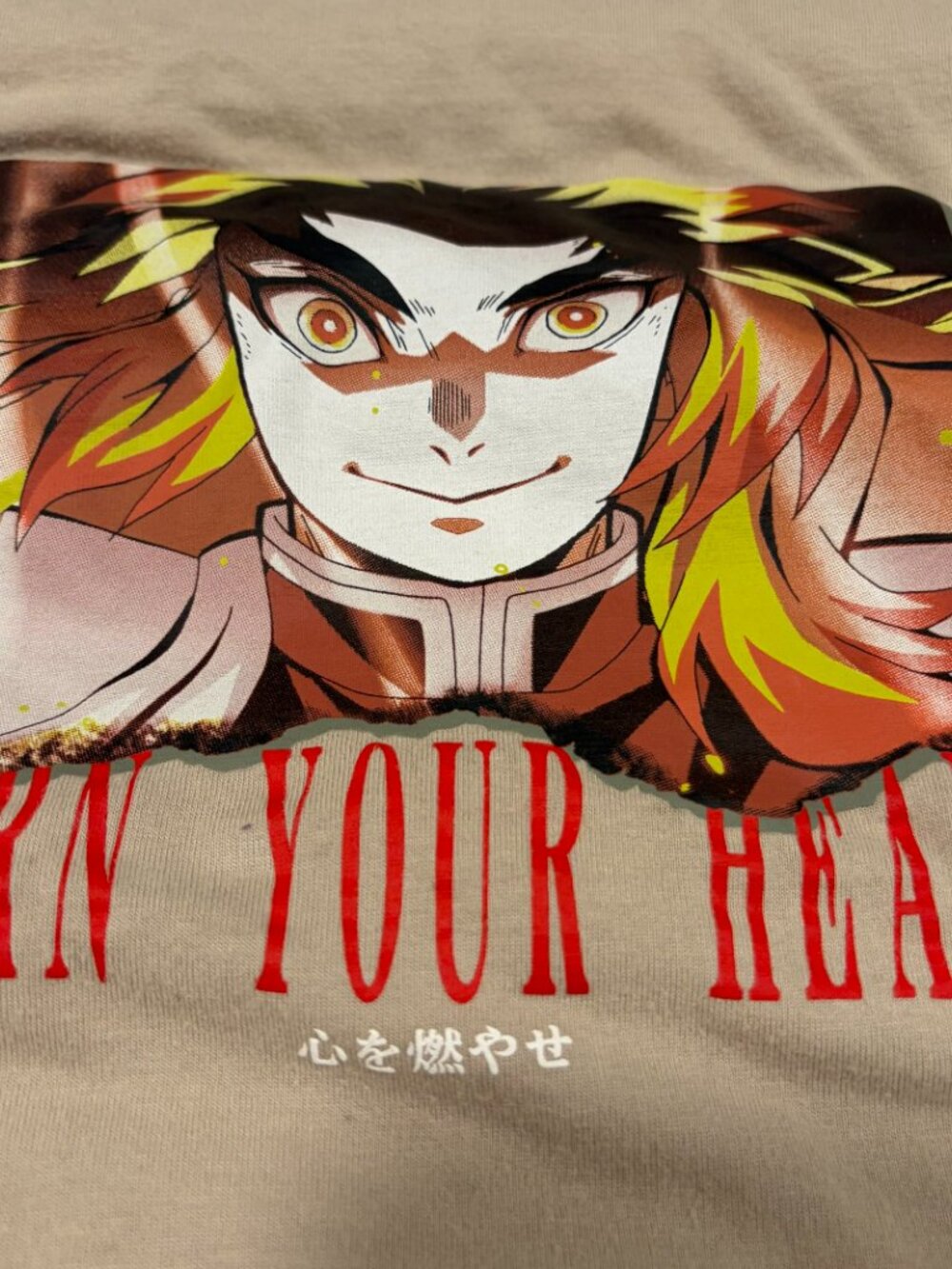 Tan Uniqlo Demon Slayer Rengoku t-shirt, 100% cotton size small
